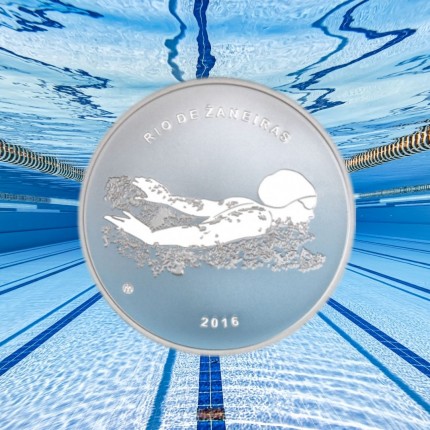 On Olympic coin — image of a girl swimming towards victory