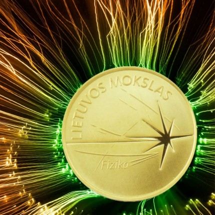 Glittering laser star on gold coin